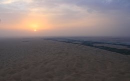Sunrise over Arabian desert from hot air balloon