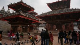 A temple in Kathmandu Durbar Square with lots of pigeons