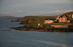 Sailing into the Shetland Islands at sunrise